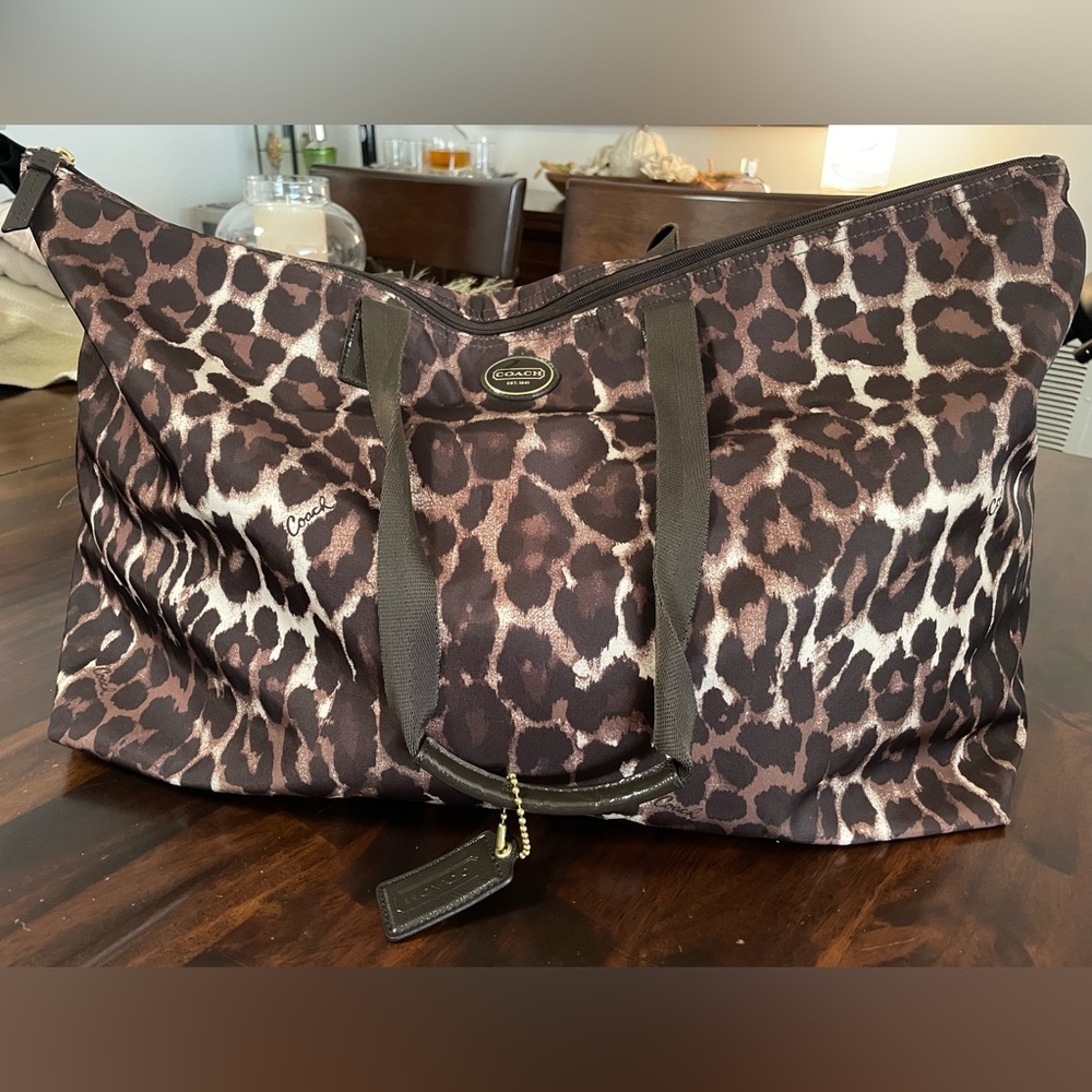 Coach collapsible Ocelot duffel bag. 22”x12”. EUC no rips or stains.
